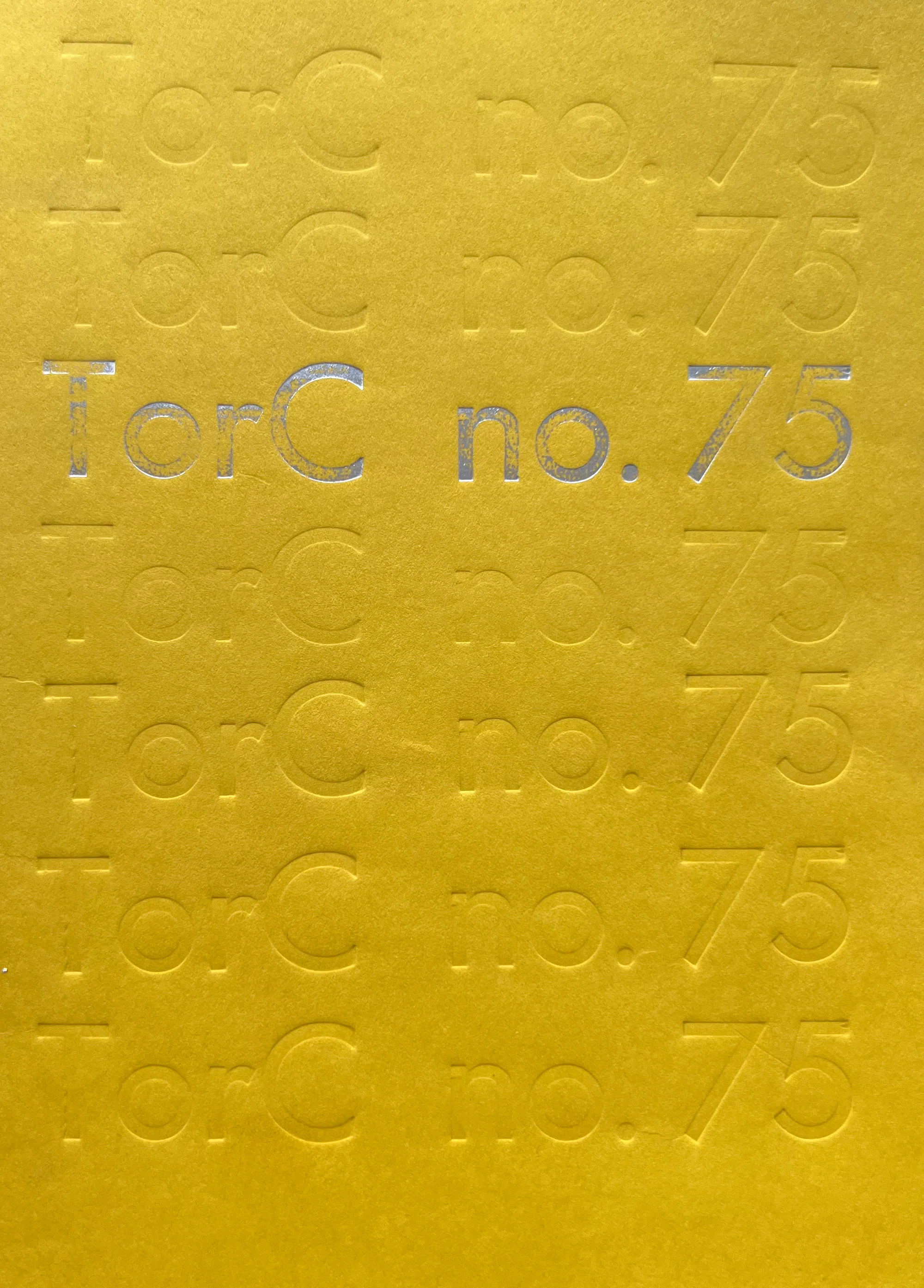 TorC no.75 Cover A yellow uncoated cardstock soft cover book with foil stamped title: TorC no.75 as well as blind debossing of the same title